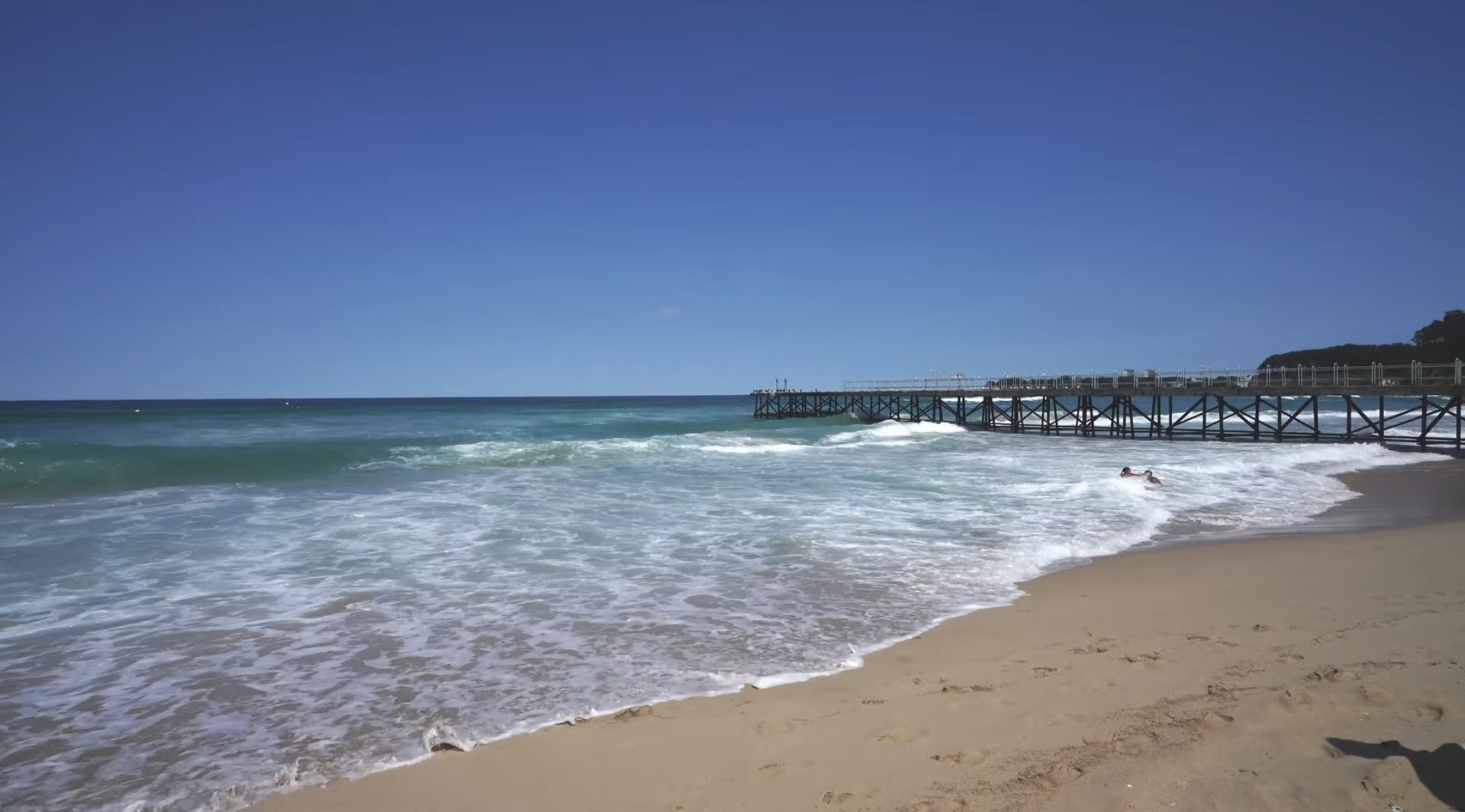 Beach pier and waves in Tsarevo, Bulgaria